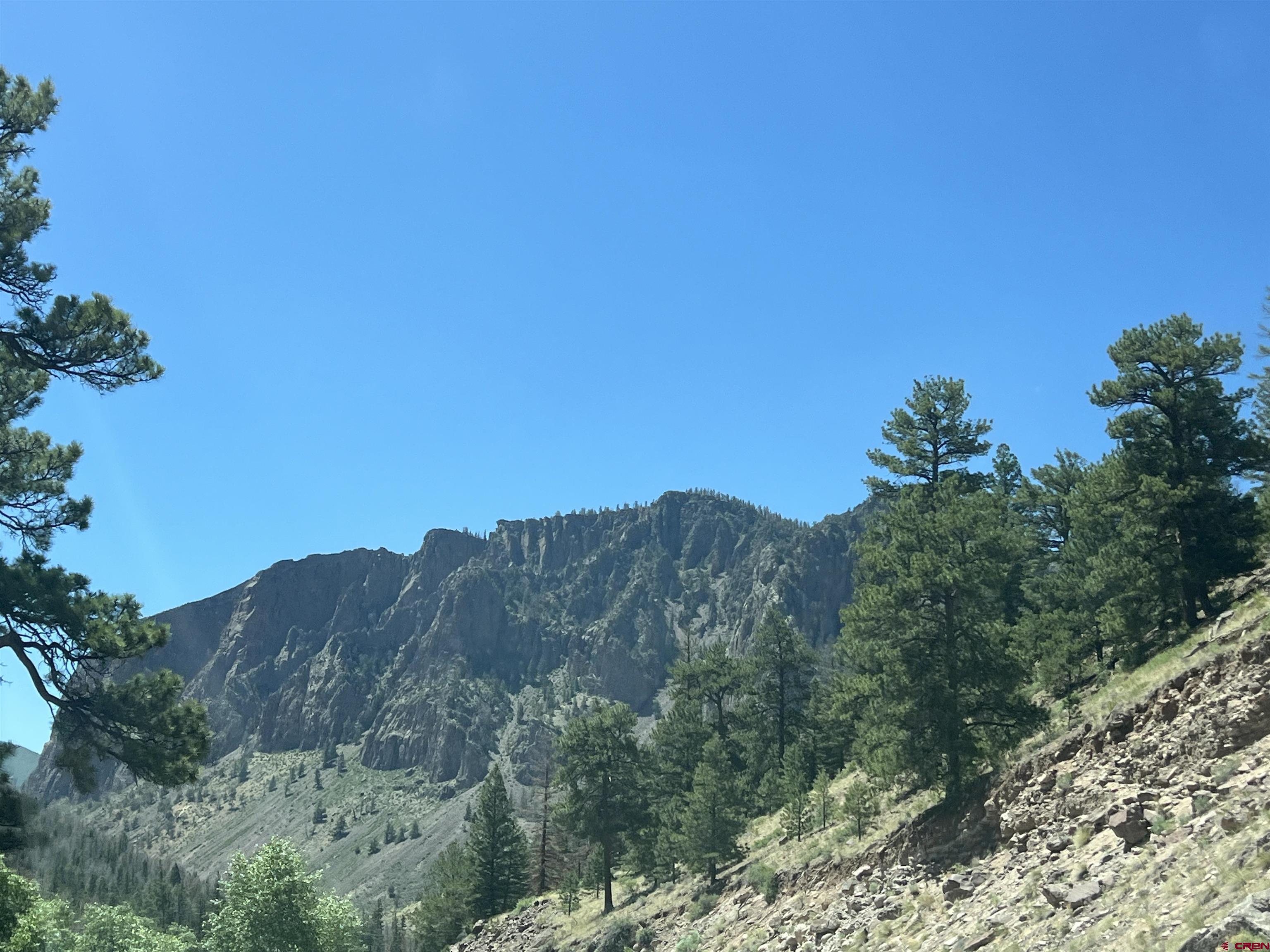 127 Browns Road South Fork, CO 81154 - Photo 36 of 44 a view of a mountain range with trees in the background