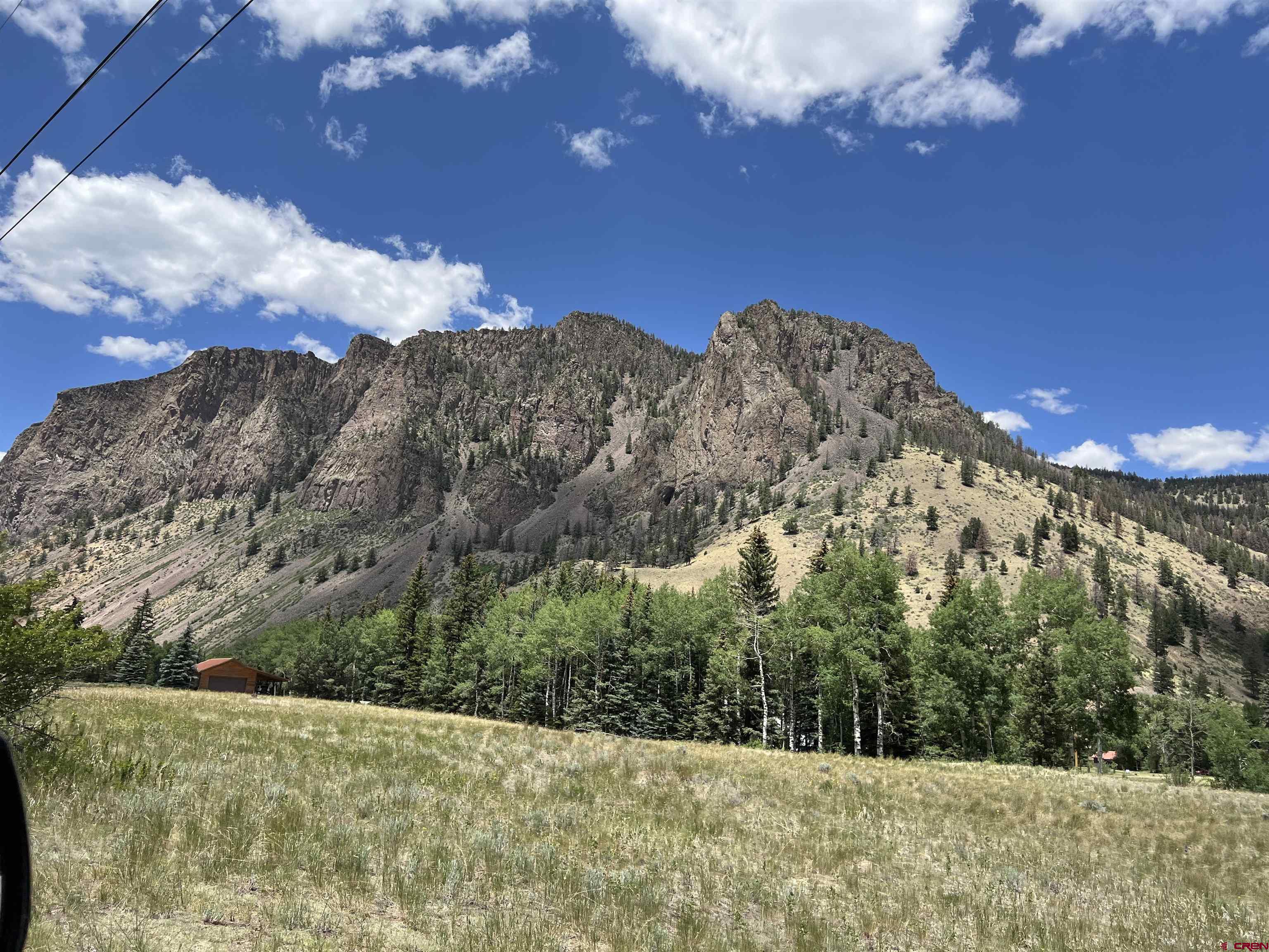 127 Browns Road South Fork, CO 81154 - Photo 37 of 44 a view of a building with mountains in the background