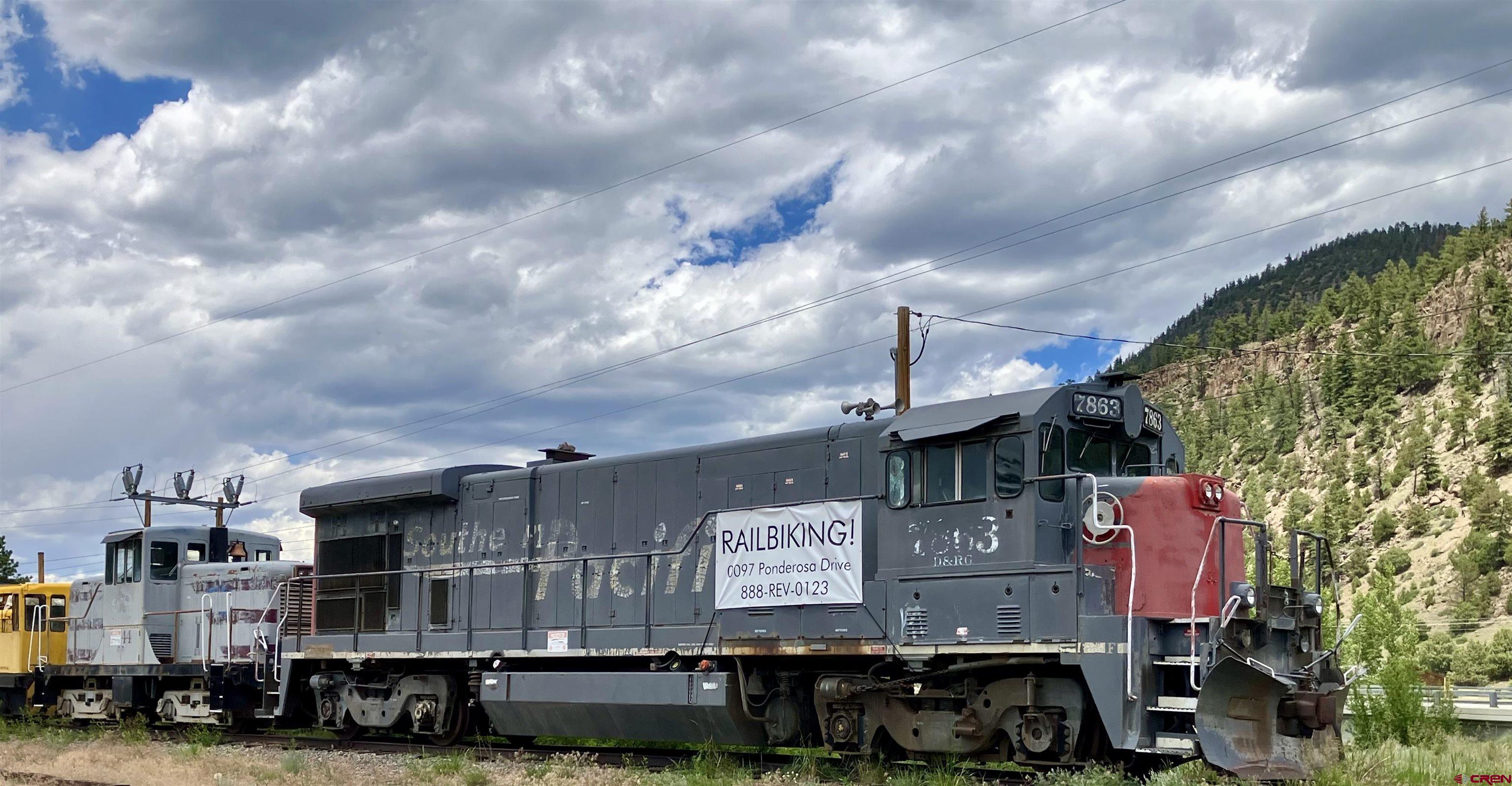 127 Browns Road South Fork, CO 81154 - Photo 42 of 44 a front view of a building with lot of cars and trees