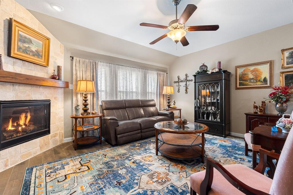 300 Copper Switch Drive Anna, TX 75409 - Photo 11 of 26 Spacious Living Room with ceiling fan and large wall of Windows