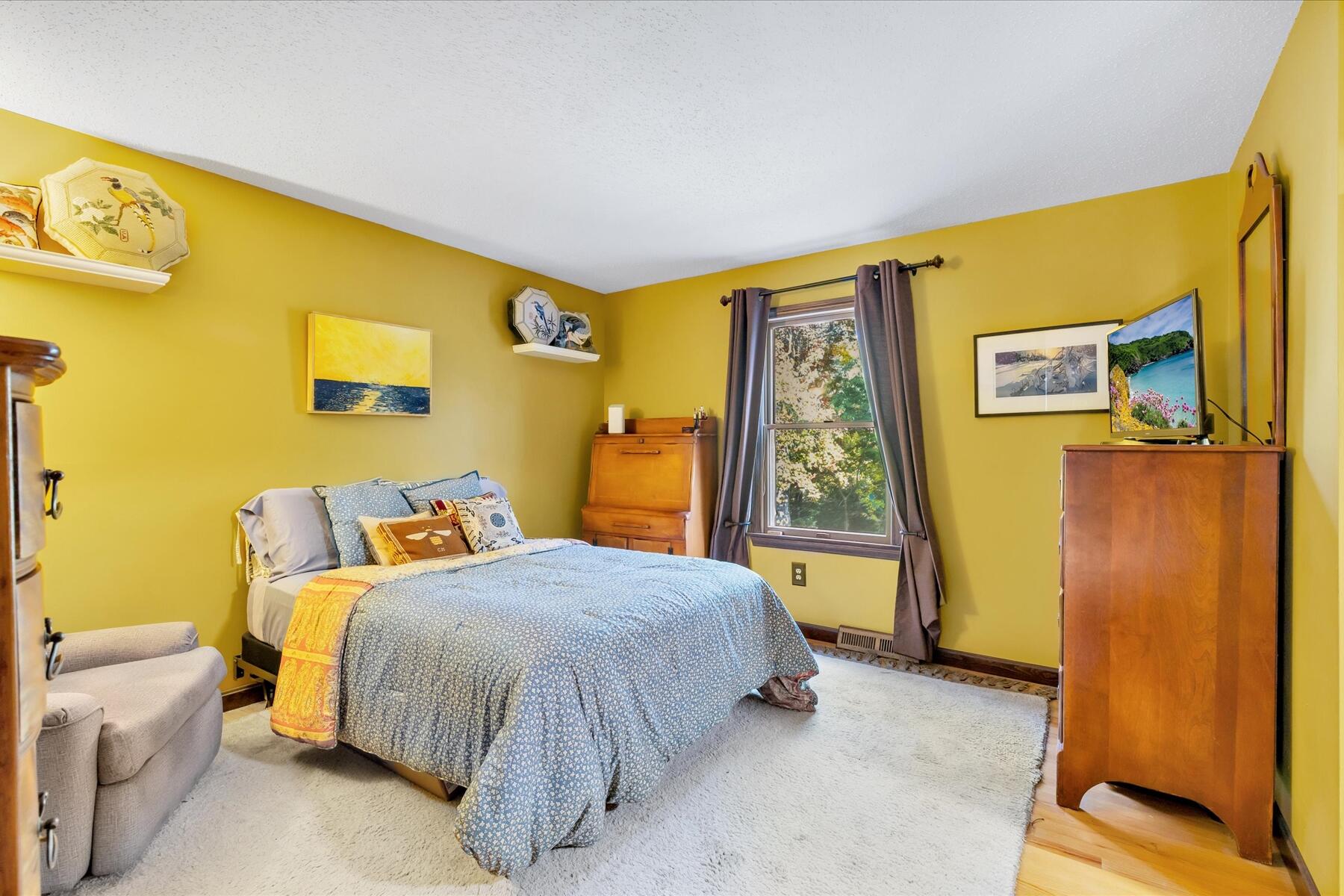 7 Sandy Way Mashpee, MA 02649 - Photo 14 of 41 a bedroom with a bed and a wall painting