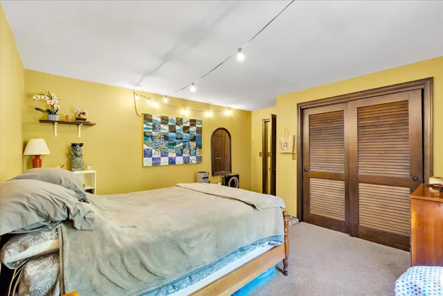 a view of a roof deck with table and chairs and wooden floor
