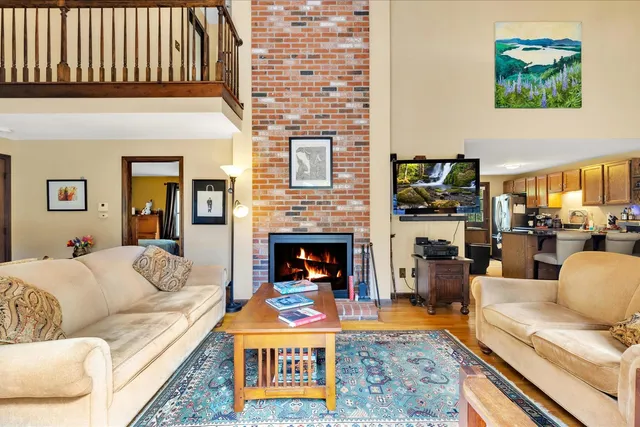 a living room with furniture fireplace and a flat screen tv
