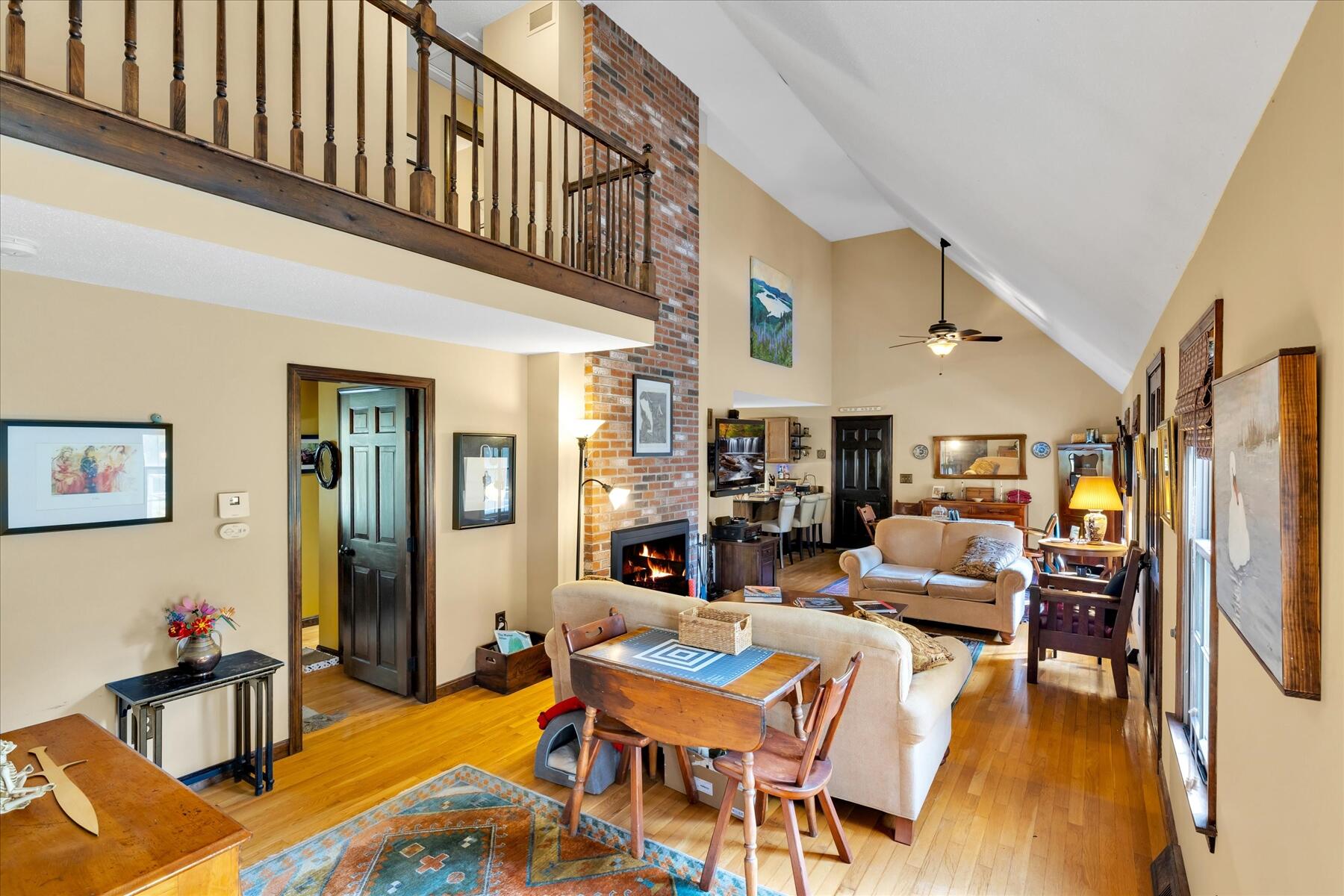 7 Sandy Way Mashpee, MA 02649 - Photo 4 of 41 a living room with fireplace furniture and a wooden floor