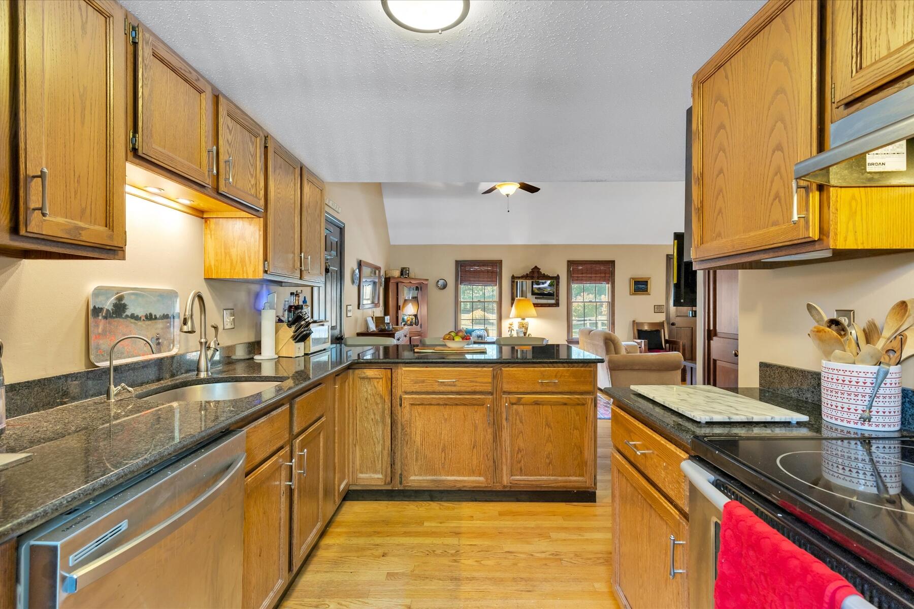 7 Sandy Way Mashpee, MA 02649 - Photo 8 of 41 a kitchen with stainless steel appliances granite countertop a sink and a stove
