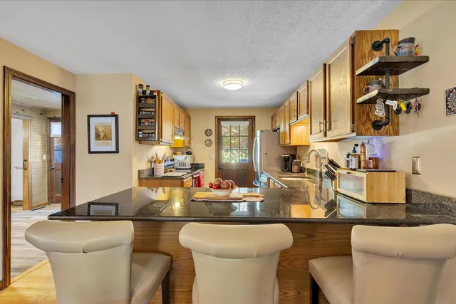 a white bath tub sitting in a bathroom next to a window