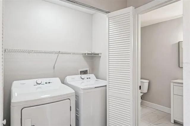 a utility room with dryer and washer