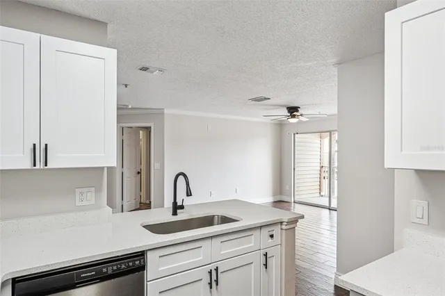 a kitchen with a sink and cabinets
