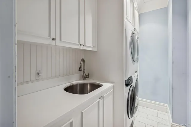 a bathroom with a sink and washing machine
