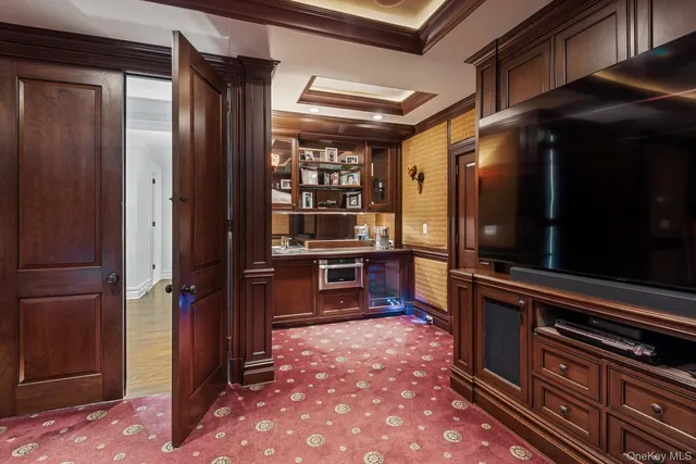 a kitchen with refrigerator and cabinets