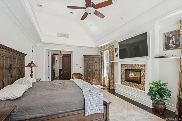 a bedroom with a bed and a fireplace