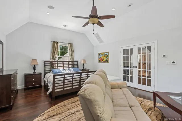 a bedroom with a bed furniture and a window
