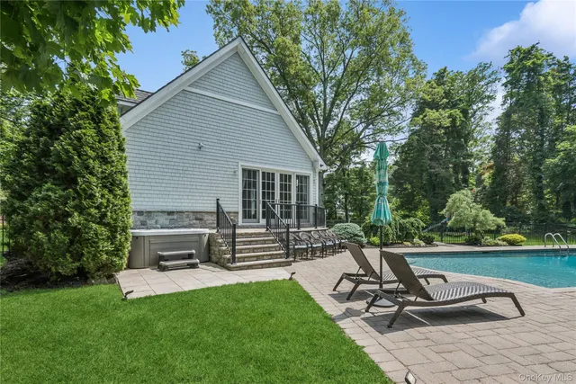 a view of a backyard with sitting area and garden