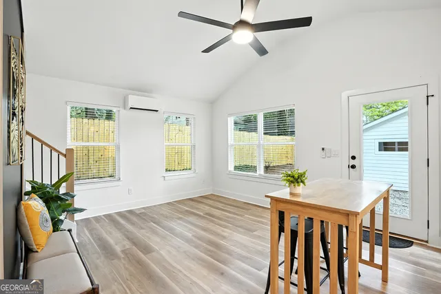 a workspace with furniture window and wooden floor
