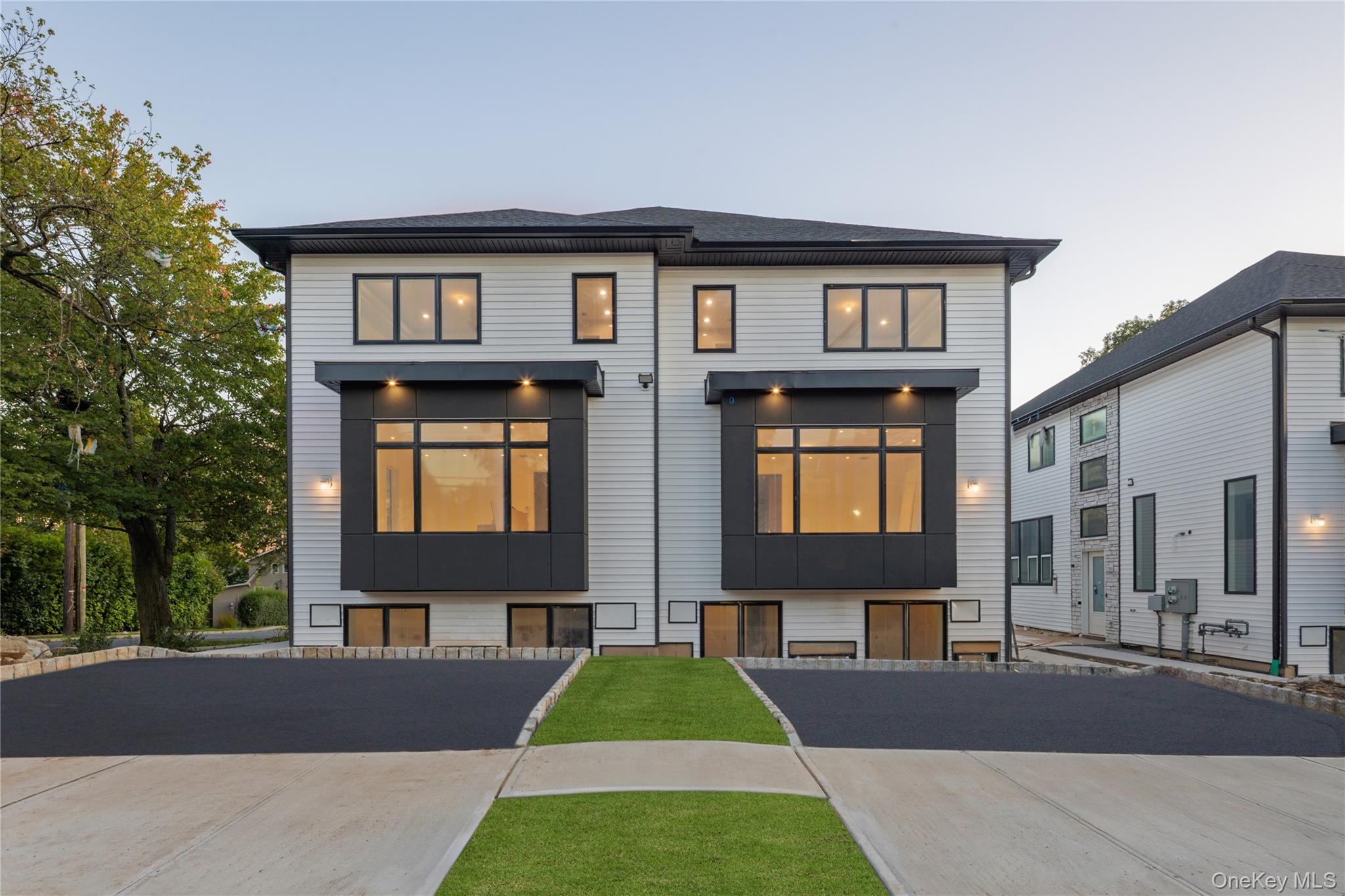 18 West Funston Avenue, Unit 212 Spring Valley, NY 10977 - Photo 1 of 1 a front view of a house with garden