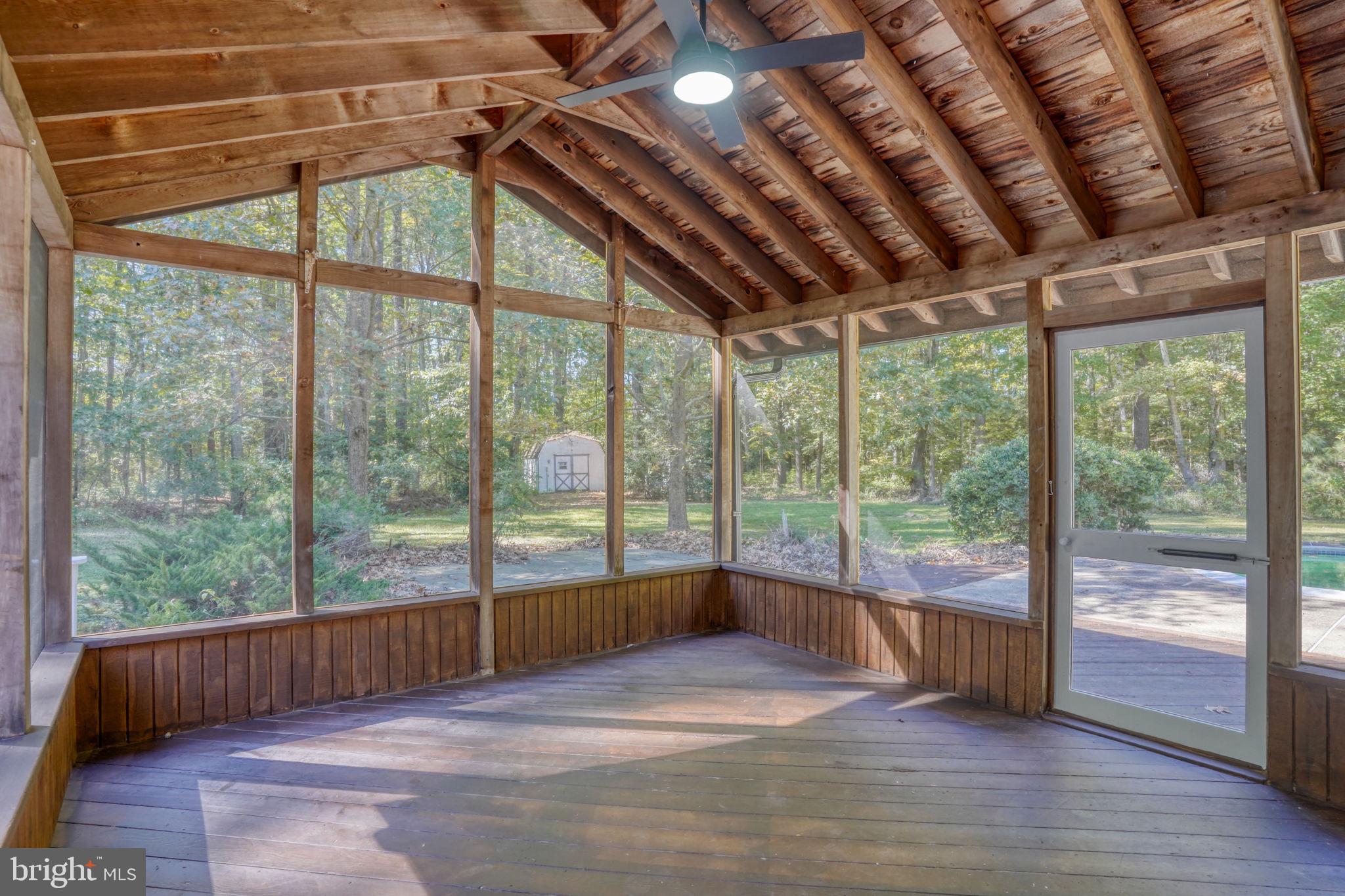 4570 Evergreen Road Oxford, MD 21654 - Photo 26 of 27 a view of empty room with wooden floor and city view