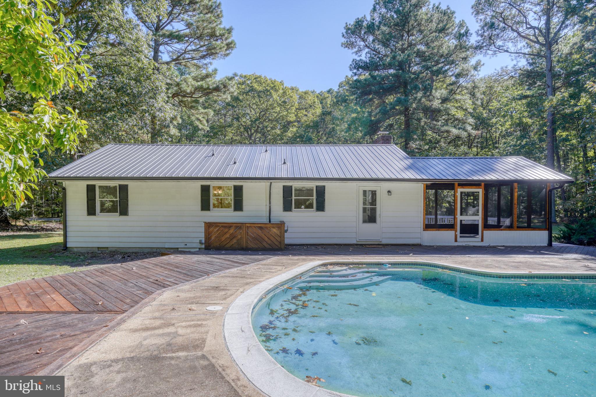 4570 Evergreen Road Oxford, MD 21654 - Photo 6 of 27 front view of a house with a yard