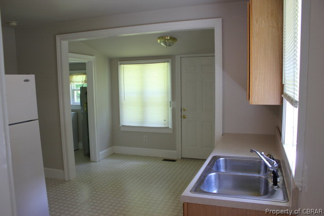 1239 Tabernacle Road Mathews, VA 23109 - Photo 7 of 22 a room with a small mirror