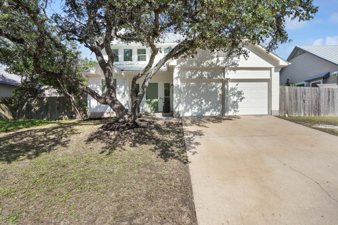 a view of road with large trees