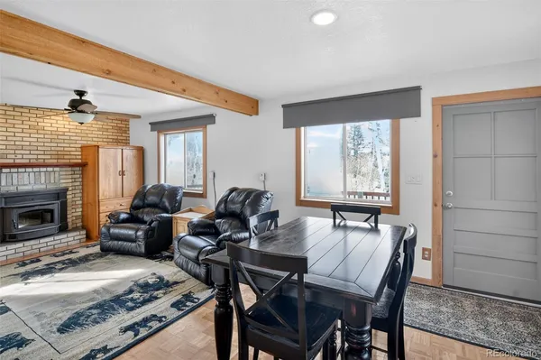 a living room with furniture a fireplace and a table