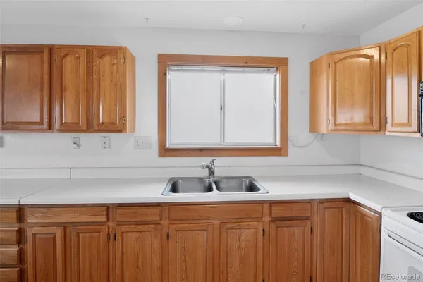 a kitchen with stainless steel appliances granite countertop a sink and a cabinets