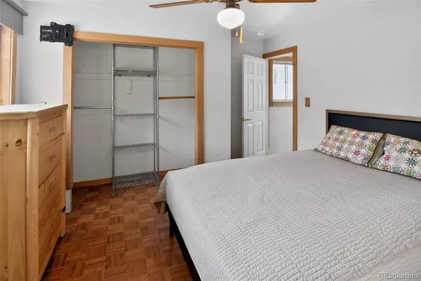 a bed room with a bed and a window