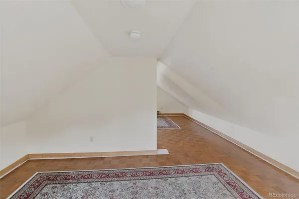 a view of staircase with rug