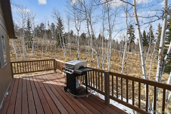 a view of a two chairs on the roof deck