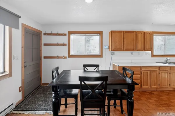 a view of a dining room with furniture and window