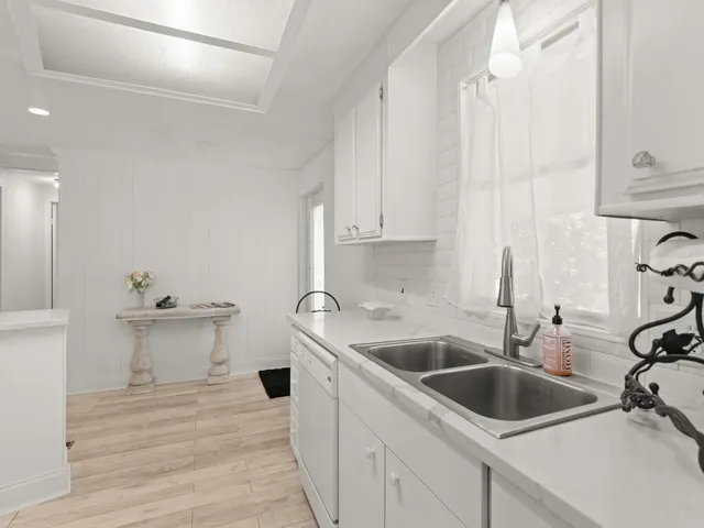 a kitchen with a sink and cabinets