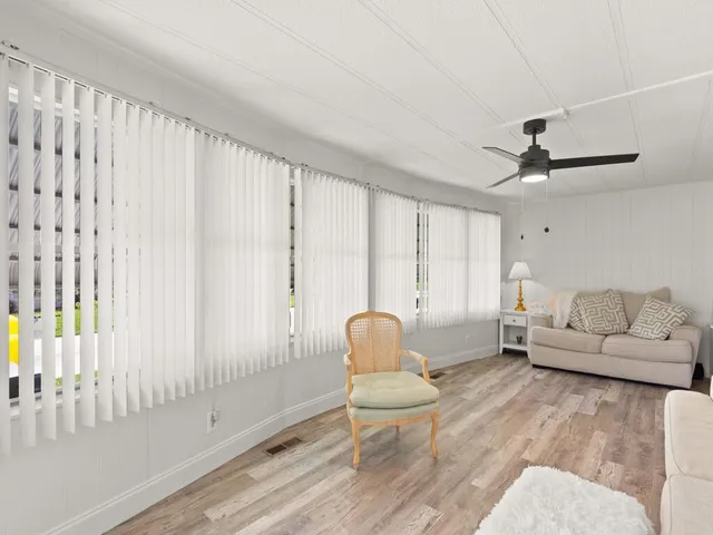 a living room with furniture and a window