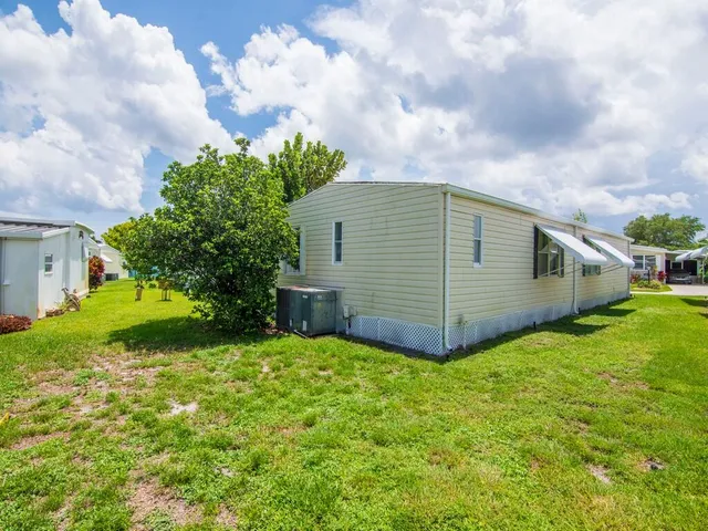 a view of a backyard of the house