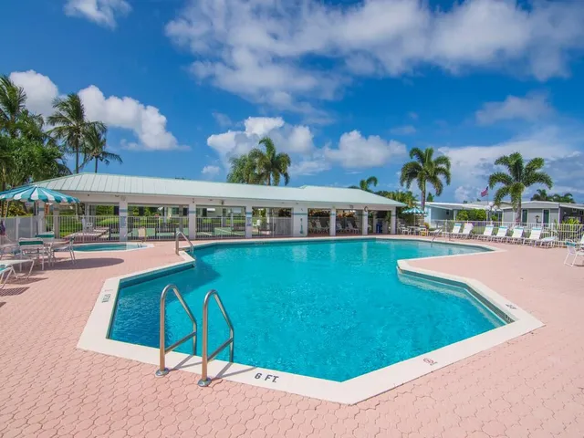 swimming pool view with a seating space