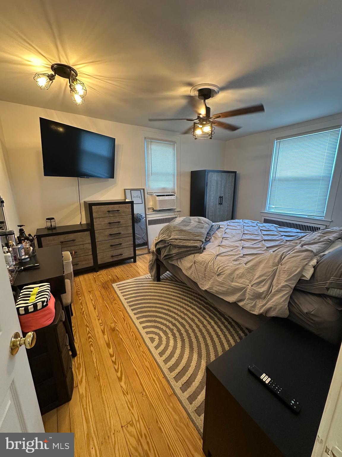 520 Walnut Street Audubon, NJ 08106 - Photo 6 of 8 a bedroom with a bed and a flat screen tv