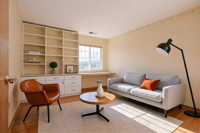 a living room with furniture and a window