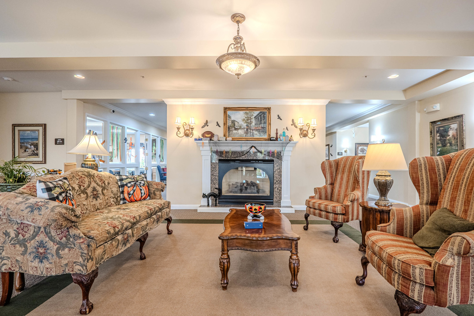 801 North McLean Boulevard, Unit 320 Elgin, IL 60123 - Photo 20 of 38 a living room with furniture and a chandelier