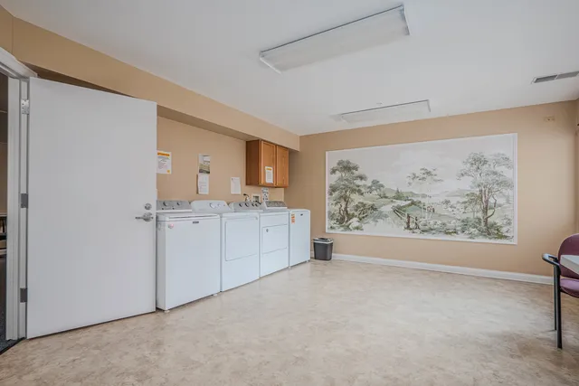 a view of room with window and bathroom