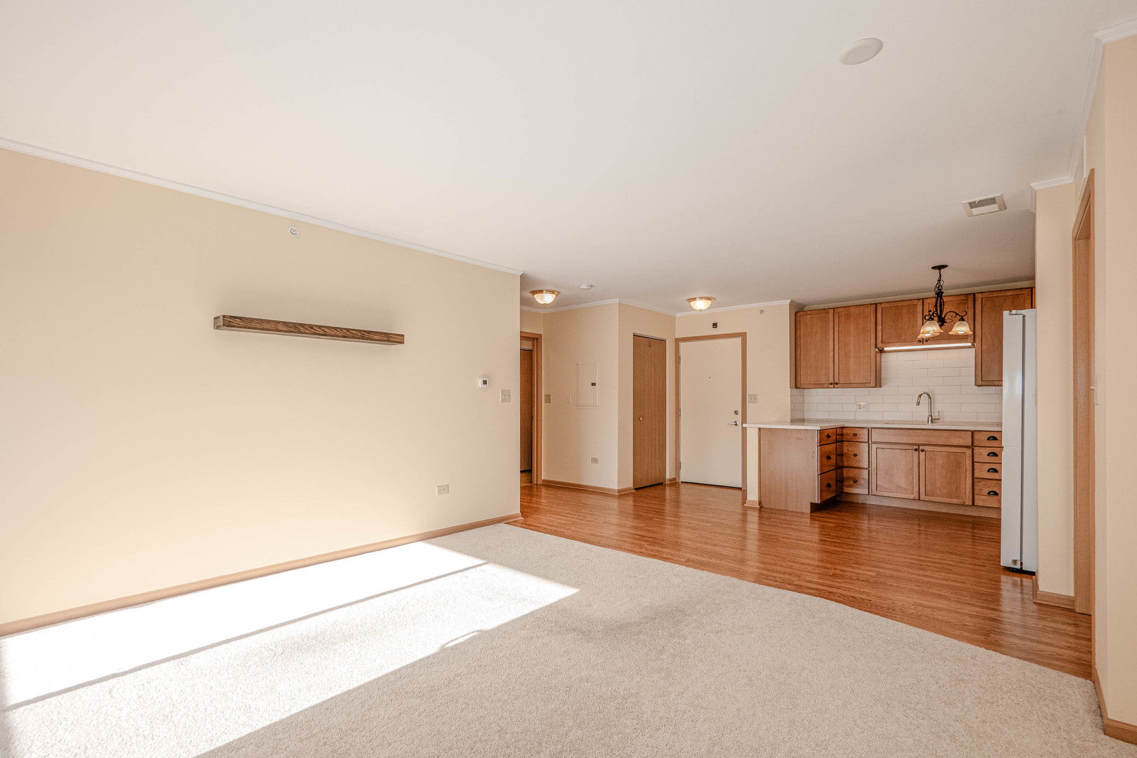 801 North McLean Boulevard, Unit 320 Elgin, IL 60123 - Photo 5 of 37 a view of a kitchen with kitchen island stainless steel appliances counter space and wooden floor