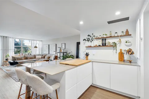 a view of a kitchen cabinets and living room