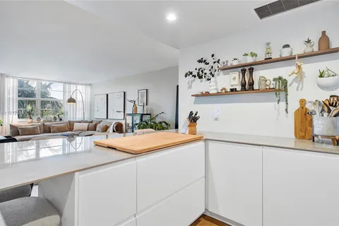 a kitchen with stainless steel appliances a refrigerator and a sink