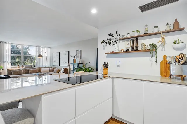 a kitchen with a sink and a refrigerator