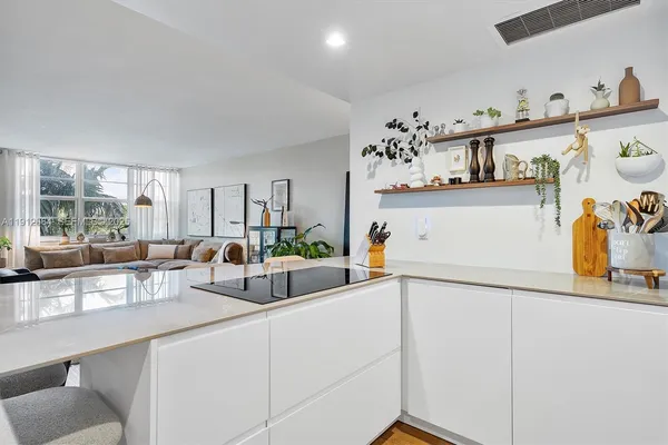 a kitchen with a sink and a refrigerator
