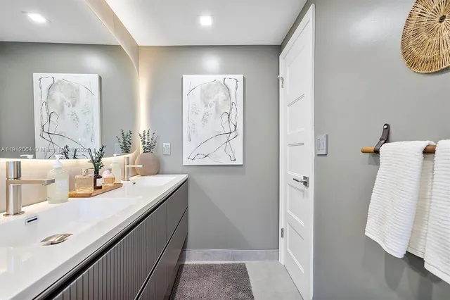 a bedroom with a bed and a flat screen television