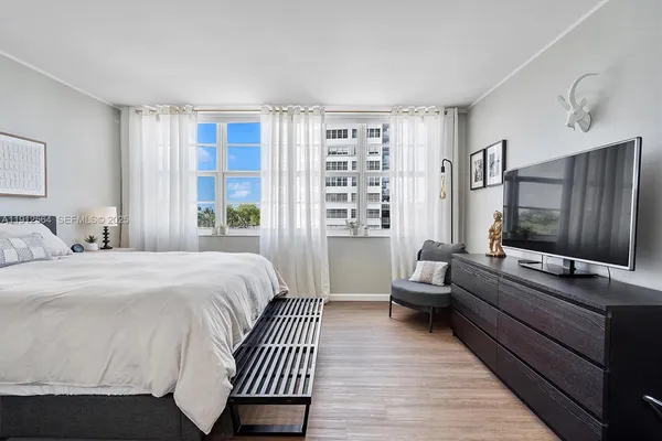 a bedroom with a bed and a lamp