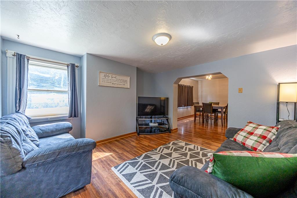 201 Walters Lane Springdale, PA 15144 - Photo 11 of 24 a living room with furniture and a flat screen tv