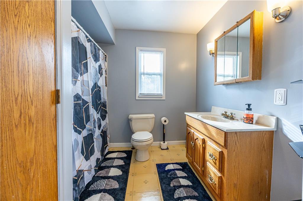 201 Walters Lane Springdale, PA 15144 - Photo 16 of 24 a view of a bathroom with a sink and a toilet