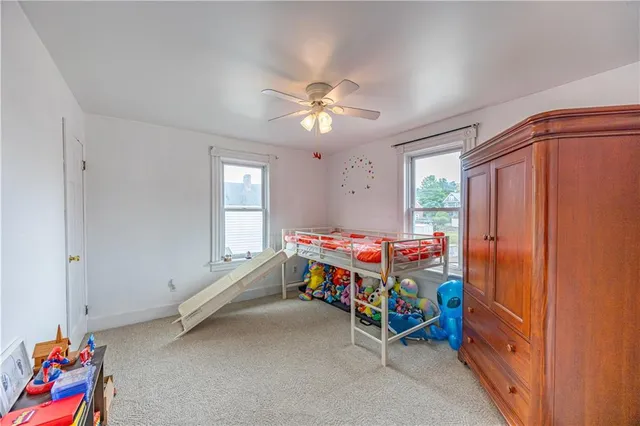 a room with toys and ceiling fan
