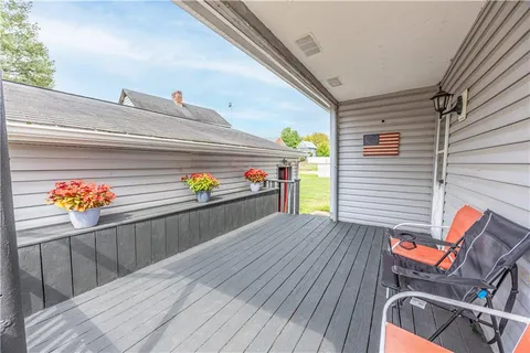 a view of a house with a yard and garage