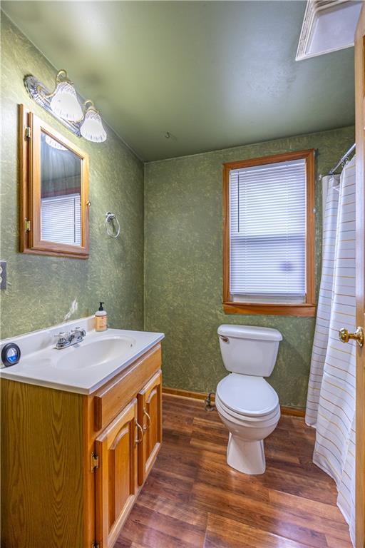 201 Walters Lane Springdale, PA 15144 - Photo 7 of 24 a bathroom with a granite countertop toilet sink and mirror