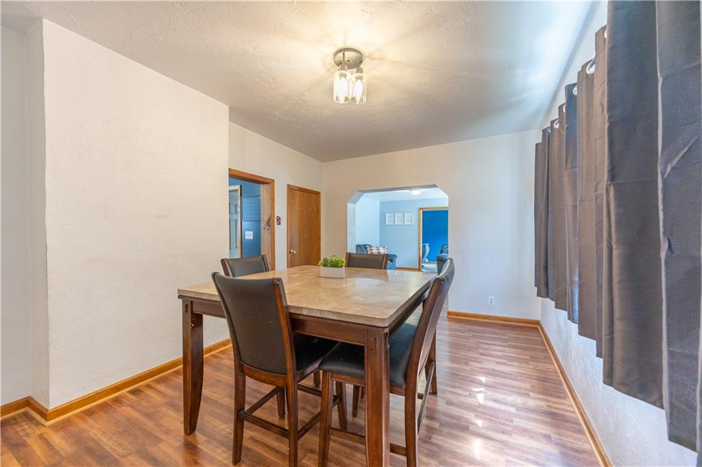 201 Walters Lane Springdale, PA 15144 - Photo 8 of 24 a view of a dining room with furniture and wooden floor